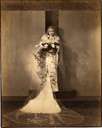 "Here's my grandmother in her wedding dress which she designed. I am in awe of her veil and the train. It must have been amazing. Unfortunately, this is the only photo we have of the wedding. There's none of my grandpa whatsoever. I think her family in Shanghai has the rest and I hope one day I can go back and see the rest of these memories." Amy Wang: Shanghai c.1930: Copyright Natalie Zee Drieu
